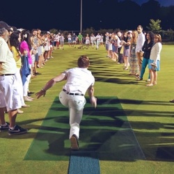 Image - Man demonstrating bowling delivery at Lawn Summer Nights event